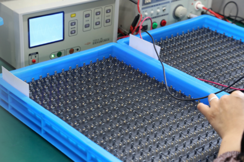 A custom-designed solenoid coil being tested in a lab environment