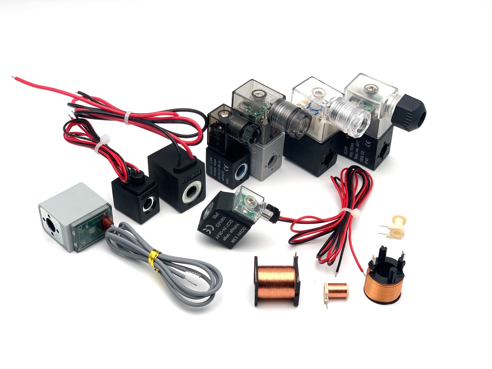 A quality control engineer inspecting micro coils with a microscope